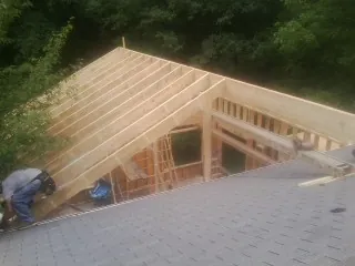Framing a new roof addition that ties into an existing shingle roof in Newton